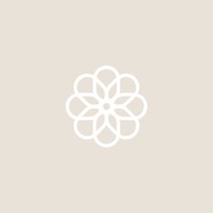 a white flower on a beige background with the words,'i am not sure what this