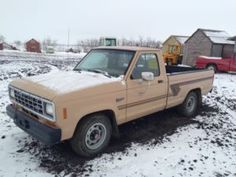 the truck is parked in the snow outside