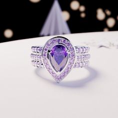 Introducing The Violet Tear: Crafted as a 3-in-1 ring set with 1 primary gemstone band and 2 ring classical bands that stack perfectly with the main ring. This classical band is perfect for any occassion. As a gift for her, an engagement ring or a gift for yourself - because you deserve it - it is guaranteed to impress. A bright and shiny pear-cut simulated Amethyst makes this ring stand out and is sure to bring lots of compliments. The halo is adorned with sparkly simulated diamonds - we guaran Blood Diamond, Ring Stand, Special Girl, Luxury Gift Box, Silver Pieces, Amethyst Ring, Pear Cut, 3 In 1, Eternity Bands