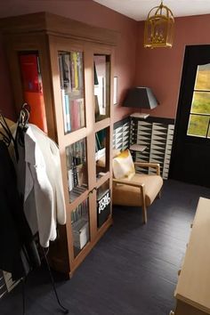 a living room filled with furniture and bookshelves