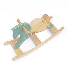 a wooden rocking horse with an elephant on it's back and the body painted green