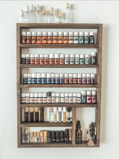 "Handmade wood shelving, perfect for essential oils, nail polish, thread & more! My husband hand makes each and every one! dim. are 26\"tall x 17\" wide 1.5\" deep The openings are 3.5\"tall & the larger area is 7.5\"tall Custom orders upon request. Satisfaction guaranteed! Thanks for looking!" Storage For Essential Oils, Essential Oil Rack, Essential Oils Organization, Nail Polish Shelf, Oil Rack, Oil Shelf, Ideas Habitaciones, Essential Oil Shelf, Essential Oil Holder