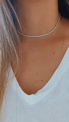 Cubic Zirconia Tennis Necklace | 14K Gold Filled | 2.2 MM Diamond Tennis Choker Necklace | Bridal Jewelry | Dainty Minimalist Necklace ------------------------------------------------- ♦ --------------------------------------------------- Beautiful Tennis choker necklace. It compliments any outfit. A wonderful gift for yourself or for any loved one and friend - purchase one today!♦ Materials: 18K Gold Filled ♦ Available colors: Gold ♦ Necklace measurements: the total length is 15.5" and the ston Minimalist White Tennis Necklace, Dainty Cubic Zirconia Necklace With Diamond Accents, Dainty Diamond White Necklace With Sparkling Stones, Dainty White Gold Diamond Necklace With Sparkling Stones, Classic Crystal Clavicle Chain Jewelry, Minimalist Jewelry With Diamond White Sparkling Stones, Minimalist Jewelry With Sparkling Stones In Diamond White, Minimalist Diamond Necklace With Sparkling Stones, Minimalist Diamond White Jewelry With Sparkling Stones