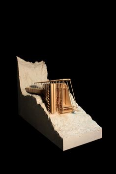 a model of a wooden structure in the sand