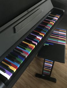 a piano that has been painted with different colors