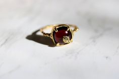 garnet statement ring Elegant Brass Rings With Gemstone, Elegant Brass Promise Rings, Elegant Brass Rings With Cabochon, Elegant 22k Gold Jewelry With Bezel Setting, Elegant 22k Gold Rings With Bezel Setting, Nature-inspired Yellow Gold Gemstone Rings, Elegant 22k Gold Ruby Ring, Elegant Hand Forged Yellow Gold Ruby Ring, Handmade 14k Gold Elegant Ruby Ring