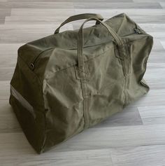 🎁 10-50% off storewide 🎁 *ends 26 Dec  Vintage military surplus army issue duffel bag.  Large roomy rectangular shape with short handles & a zippered top. Features a clear window pocket to one side. 100% cotton canvas Bag is 24" across & 15" tall with a base width of 10.5".  Excellent vintage brand new deadstock condition - exactly as pictured. * * * Visit the shop for more! * * * fivestonesvintage.etsy.com  Instagram @fivestonesvintage  Low international shipping! Postage is automatically com Military Bag, Military Surplus, Clear Window, Duffel Bags, Travel Duffel, Duffel Bag Travel, Vintage Branding, Vintage Military, Boston Bag