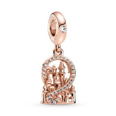 Wear your excitement for a Disney Parks visit with this enchanting Dangle Charm from Pandora. Hand-finished in 14k rose gold plating, this warm-toned keepsake features a 3D Fantasyland Castle framed by a swirl of sparkling clear cubic zirconia pavé. This charming souvenir is inspired by the iconic castles at Disney Parks, so that true fans can carry the magic with them everywhere they go. Disney Easter Basket, Disney Charms, Pandora Disney, Pandora Bracelet Charms, Pandora Charm, Dangle Charms, Pandora Bracelet, Pandora Jewelry, Disney Store