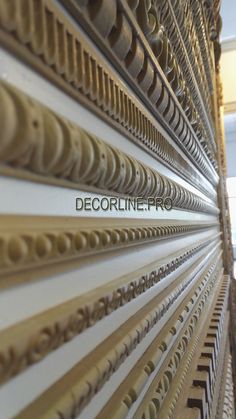 the wall is made up of many different types of decorative items, including wooden blinds