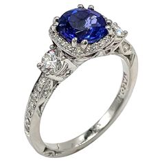 Tacori platinum"Dantela” Collection three stone ring with diamonds totaling 0.68 carats (G Color, VS Clarity) and one center round, brilliant-cut tanzanite totaling 1.59 carats. - Style no. 2623RDMDP - Finger size 6.5 - Comes with original Tacori box Tacori Dantela, Three Stone Ring, Platinum Engagement Rings, Platinum Ring, Three Stone Rings, Hand Engraving, Three Stone, Stone Ring, Tanzania