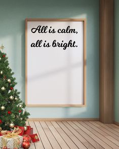 a christmas tree with presents under it in front of a sign that says all is calm, all is bright