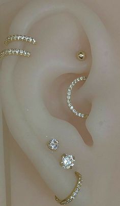 three different types of ear piercings on top of each other