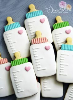 decorated cookies with baby bottles and hearts on them