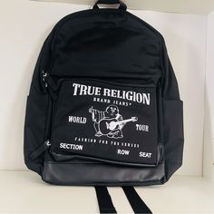 Nwt True Religion Buddha Black Backpack Casual Black Backpack With Letter Print, Casual Streetwear Backpack With Letter Print, Casual Letter Print Backpack For Streetwear, Urban White Bags With Large Capacity, White Large Capacity Backpack For Streetwear, Casual Letter Print Standard Backpack, Urban Style Large Capacity White Bags, Urban Large Capacity White Bags, Trendy Black Backpack For Streetwear