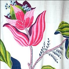 a white curtain with pink and green flowers on it