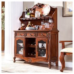 a wooden cabinet with wine glasses on it