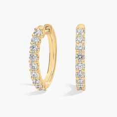 Bright diamonds shimmer brilliantly along the front-facing edge of these timeless hoop earrings. The warm lustre of the 18k yellow gold adds a look of timeless luxury to your style. Timeless Luxury, Diamond Hoop Earrings, Blue Nile, Diamond Fashion, Fashion Earrings, Diamond Earrings, Jewelry Earrings, Hoop Earrings, Diamonds