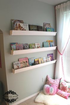 a child's room with bookshelves and stuffed animals