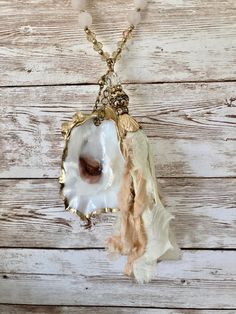 Suede and Beaded Tassel Necklace With Real Oyster Shell - Etsy Bohemian Shell Cream Jewelry, Bohemian Cream Shell Jewelry, Bohemian Style Cream Shell Jewelry, Bohemian Long Necklace With Pearl Charm, Bohemian Shell Jewelry In Cream, Bohemian Gold Tassel Necklace For Gift, Bohemian Gold Tassel Necklace, Bohemian Gold Tassel Necklace As Gift, Beige Bohemian Shell Jewelry