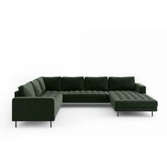 a green sectional couch sitting on top of a white floor