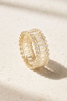 Eternity rings are a long-heralded symbol of never-ending love, and Sydney Evan's version is incredibly beautiful. Cast from 14-karat gold, it's set with continuous lines of sparkling baguette-cut diamonds surrounded by bezel-set, round-cut versions. It's housed in a designer-stamped box, rounding out the perfect gift to celebrate a milestone or anniversary. Elegant Stackable Emerald-cut Eternity Band, Luxury Gold Eternity Band With Channel Set, Luxury Gold Channel Set Eternity Band, Gold Emerald Cut Halo Jewelry, Emerald Cut Gold Halo Jewelry, Luxury Gold Stackable Rings Channel Set, Luxury Gold Stackable Rings With Channel Set, Gold Luxury Stackable Rings With Channel Set, Elegant 14k Gold Eternity Band With Halo