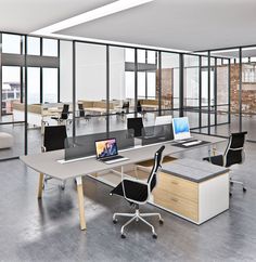 an empty office space with desks and chairs