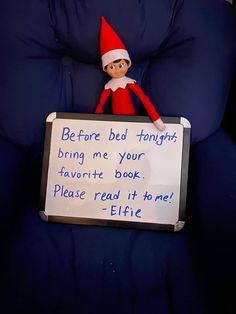 an elf is holding a sign that says before bed tonight bring me your favorite book please read it to me