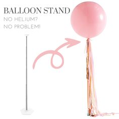 the balloon stand is pink and has an arrow sticking out of it's side