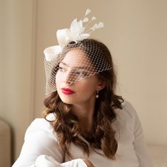 The feather bridal fascinator with birdcage veil stands for modern style bride. This elegant millinery fascinator is adorned with hand-shaped feathers that delicately frame the face.  All elaborately hand-sewn of sinamay using traditional millinery technique, the birdcage shaped on the wooden block. The headpiece is easy to place to any bridal hair style on side or to the bun, birdcage is removable.  The fascinator is on alligator clip, the veil on the flat metal hair comb. Would you prefer skin Fascinator Veil, Birdcage Wedding, Wedding Birdcage, Veil Length, Bridal Fascinator, Short Veil, Feather Fascinator, Birdcage Veil, Wedding Fascinators