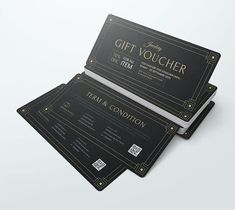 two black and gold gift voucher cards on top of each other with the words thank you