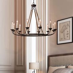 a chandelier hanging from the ceiling in a bedroom