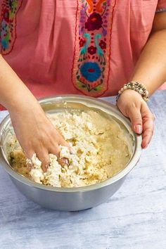 a woman is mixing food in a bowl