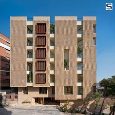 an apartment building with many windows and balconies