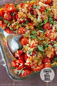 a glass casserole dish filled with tomatoes and bread crumbs, topped with parmesan cheese