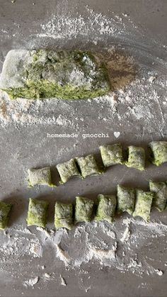 some kind of food that is on top of a table with flour and other items