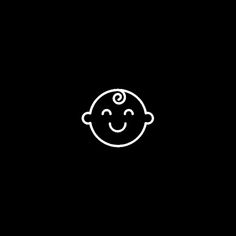 a black and white drawing of a smiling child's face on a dark background