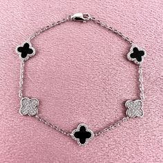 This Is An Absolutely Stunning Black Onyx Clover Statement Luxury Bracelet Crafted In 925 Solid Sterling Silver. The Clover Bracelet Has 5 Motif Clovers That Are Made Out Of Black Onyx As Well As Glistening Round Brilliant Cut White Cubic Zirconia Gemstones. It Comes With A Sterling Silver Chain That Measures 7 1/2” Inches Long. The Bracelet Is 925 Solid Sterling Silver. 5 Motif Clover Bracelet 925 Stamped *100% Brand New *100% Guarantee High Quality * 100% Lead And Nickel Free * 100% Hypoallerg Luxury Sterling Silver Jewelry With Black Enamel, Fine Jewelry In Silver With Black Enamel, Fine Silver Jewelry With Black Enamel, Luxury Black Enamel Sterling Silver Jewelry, Classic Black Bracelet With Silver Chain, Classic Black Bracelets With Silver Chain, Luxury Sterling Silver Diamond Bracelet, Black Silver Chain Bracelet Gift, Black Silver Chain Bracelet As Gift