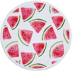 a round beach towel with watermelon slices on it