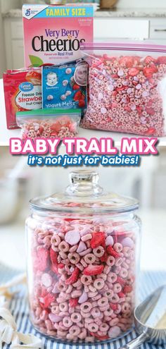 baby trail mix in a glass jar with pink and red sprinkles on top