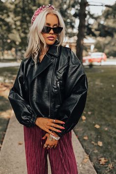 Add an edgy touch to your fall wardrobe with our chic black 'Koty' jacket featuring faux leather material, a zip closure front with a collared neckline, long loose sleeves with elastic fitted cuffs, a single accent chest pocket cut and two low pockets, and a trendy bomber silhouette that ends in a straight hemline! Measurements S : Bust 38", Hip 34", Length 19.5", Sleeve Length 20", Waist 36". M : Bust 40", Hip 36", Length 20", Sleeve Length 20.5", Waist 38". L : Bust 42", Hip 38", Length 20.5", Black Leather Jacket With Zipper For Fall, Trendy Long Sleeve Faux Leather Biker Jacket, Faux Leather Biker Jacket For Fall Streetwear, Chic Faux Leather Biker Jacket For Fall, Edgy Faux Leather Biker Jacket For Fall, Fall Biker Jacket With Zipper Closure For Night Out, Edgy Leather Jacket With Zipper Closure For Fall, Trendy Leather Jacket With Zipper Closure For Fall, Trendy Leather Jacket With Zipper For Fall