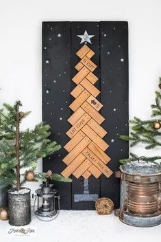 a christmas tree made out of wooden planks on top of a mantle next to other decorations