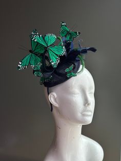 This elegant butterfly fascinator is decorated with green monarch butterflies and featured in a variety of colors on a black fascinator base and headband/clip option. You have the option to pick other colors listed or a mixed color option. The perfect holiday gift for the fashionable! Also available in other designs! I N C L U D E D Black fascinator on headband base topped with high-quality intricately detailed butterflies.  In secure box packaging to keep form.  S H I P P I N G -  Processed sam Green Spring Party Hair Accessories, Fitted Green Headband For Spring, Fitted Black Headband For Spring, Fitted Black Headband For Summer, Fitted Black Summer Headband, Spring Fitted Black Headband, Black Fascinator For Royal Ascot Garden Party, Green Headband For Kentucky Derby Party, Spring Party Green Headband