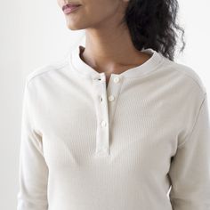 When it comes to pure versatility, very little beats the iconic Henley. Whether you roll the sleeves up and wear it with a pair of jeans, or layer it under a jean jacket, this Henley will be a year-round staple. This item will be discontinued. Future orders will require a 50 piece MOQ. Features: 3 Button Box Stitch Placket, Corozo Buttons, Pre-Washed, Ribbed Cuffs and Collar Material: 100% Cotton, 7oz Waffle Knit Fit: Model is 5'6"/120 lbs, wearing a Small. Fits true to size. Imported *Final Sal Spring Waffle Knit Tops For Workwear, Everyday Fall Waffle Knit Top, Classic Tops With Ribbed Cuffs For Everyday, Classic Everyday Tops With Ribbed Cuffs, Everyday Cream Ribbed Top, Everyday Ribbed Cream Tops, Casual Waffle Knit Henley For Fall, Classic Everyday Tops For Winter, Everyday Ribbed Button-up Top