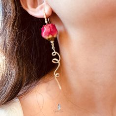 These rose flower dangle drop fashion earrings feature a real dry rose flower, dangle drop on 18k gold plated brass ear wires and gold plated spiral drop brass charm . The rose is painted with resin for protection.Add these romantic real red rose flowers dangle drop earrings to your everyday fashion jewelry collection or as gift for your love one. These red rose flower earrings can be perfect wedding bridal jewelry, bridesmaid gift as well. Materials: real roses, 18k gold plated brass Dimensions: 3.49 in x 0.60 in Jewelry Care: See more information about how to care for your jewelry here. Shipping Policy: Orders will be shipped within 1-3 business days. Economy shipping will take 7-14 days to arrive and standard shipping is 1- 4 days for U.S. orders. International shipping time is depended Gold Rose Earrings For Gift, Rose Gold Dangle Flower Earrings, Gold Dangle Flower Earrings With Rose Design, Gold Dangle Earrings With Rose Design, Real Rose Flower, Dry Rose, Real Rose, Red Rose Flower, Jewelry Bridesmaid