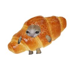 a stuffed animal that looks like a croissant with an eye on it's face