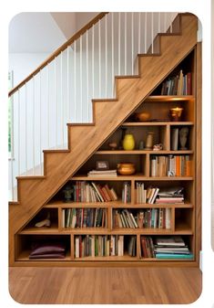 there is a book shelf under the stairs