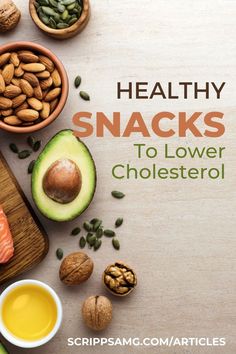 healthy snacks to lower cholestenol fats on a cutting board with nuts and avocado