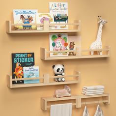 three wooden shelves with books and stuffed animals on them, along with other children's toys