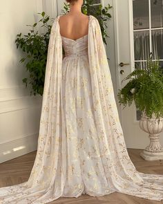 White Gilded Lily Gown | Teuta Matoshi White And Gold Dress Long, White And Gold Gown, Long Gathered Skirt, Gilded Lily, Long Flowy Dress, White Flowy Dress, White Gold Dress, Gown Gold, Wedding Dress Flowy