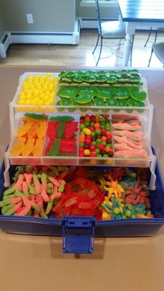 a tray filled with lots of different colored candies